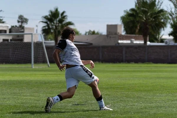soccer striker shooting goal